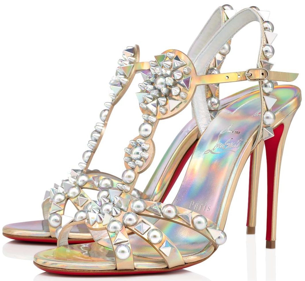 Rendered in iridescent leather, these stiletto-heel party sandals are decorated with circular and spiked studs