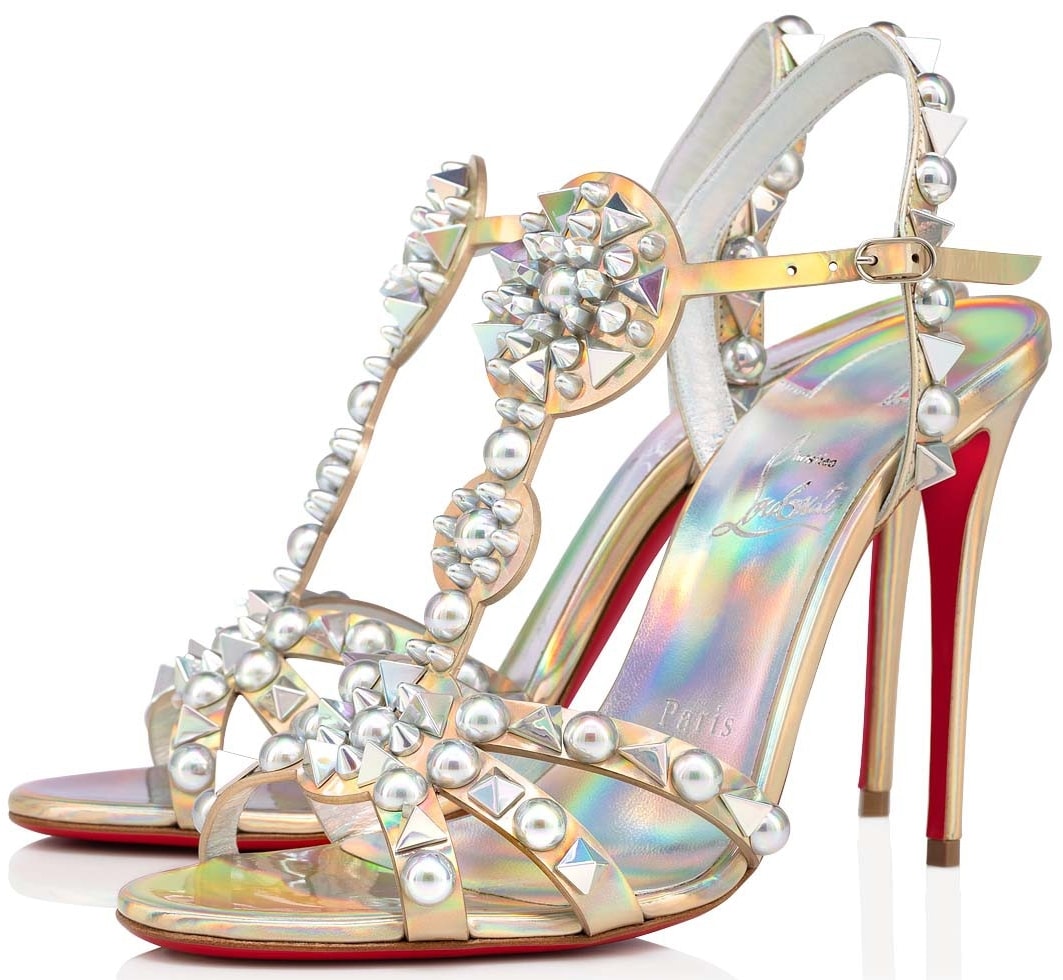 Rendered in iridescent leather, these stiletto-heel party sandals are decorated with circular and spiked studs