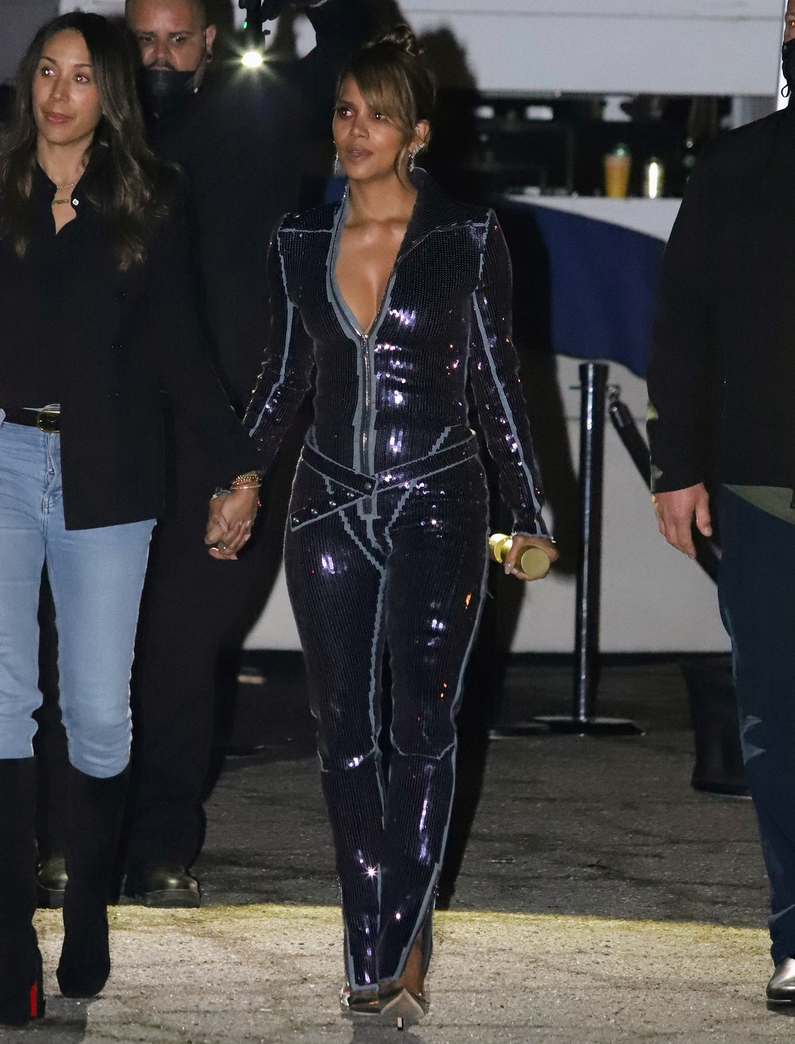 Halle Berry channels her inner Catwoman in a plunging purple sequin catsuit