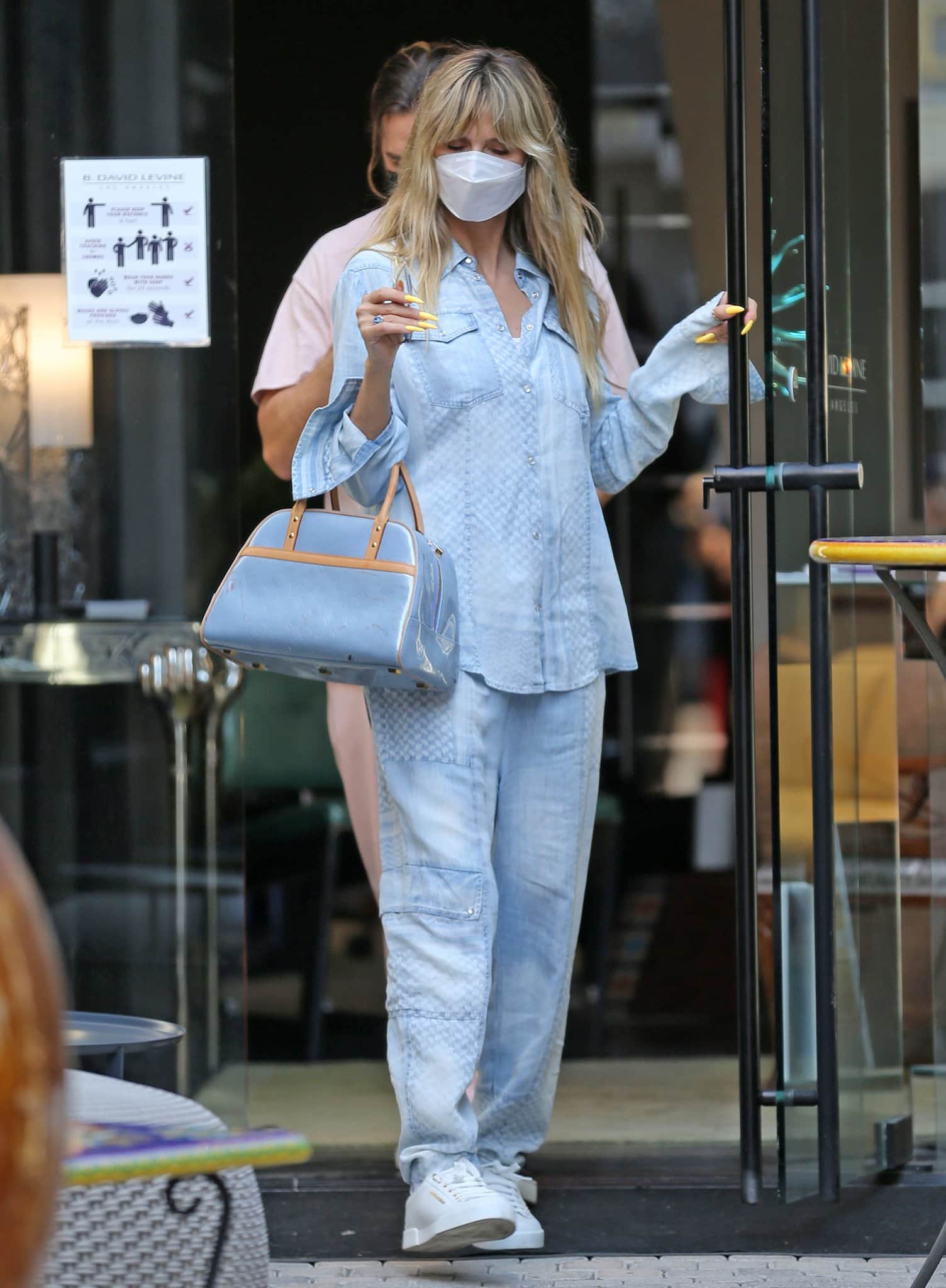 Heidi Klum opts for a denim-on-denim look with a Lala Berlin shirt and cargo pants