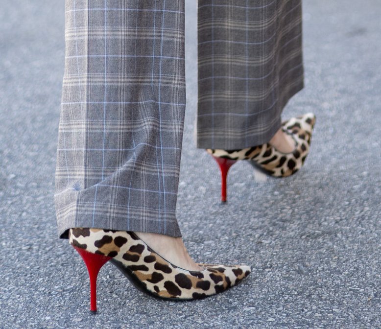 Heidi Klum pairs her leopard-print coat with plaid pants and leopard-print pumps with red heels