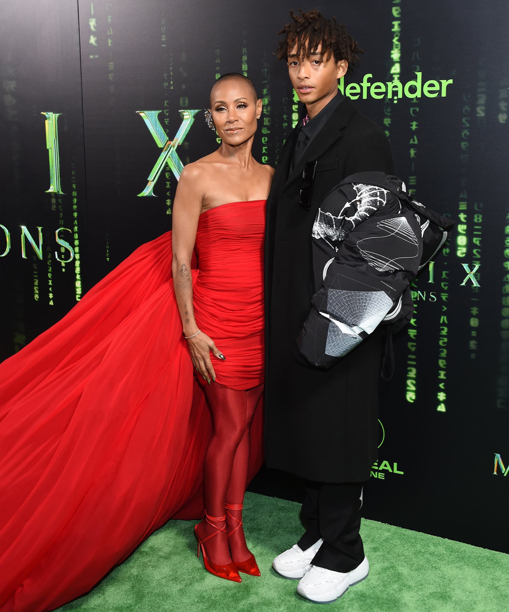 Jada Pinkett Smith poses with her son, Jaden Smith, who's clad in a black coat and white sneakers