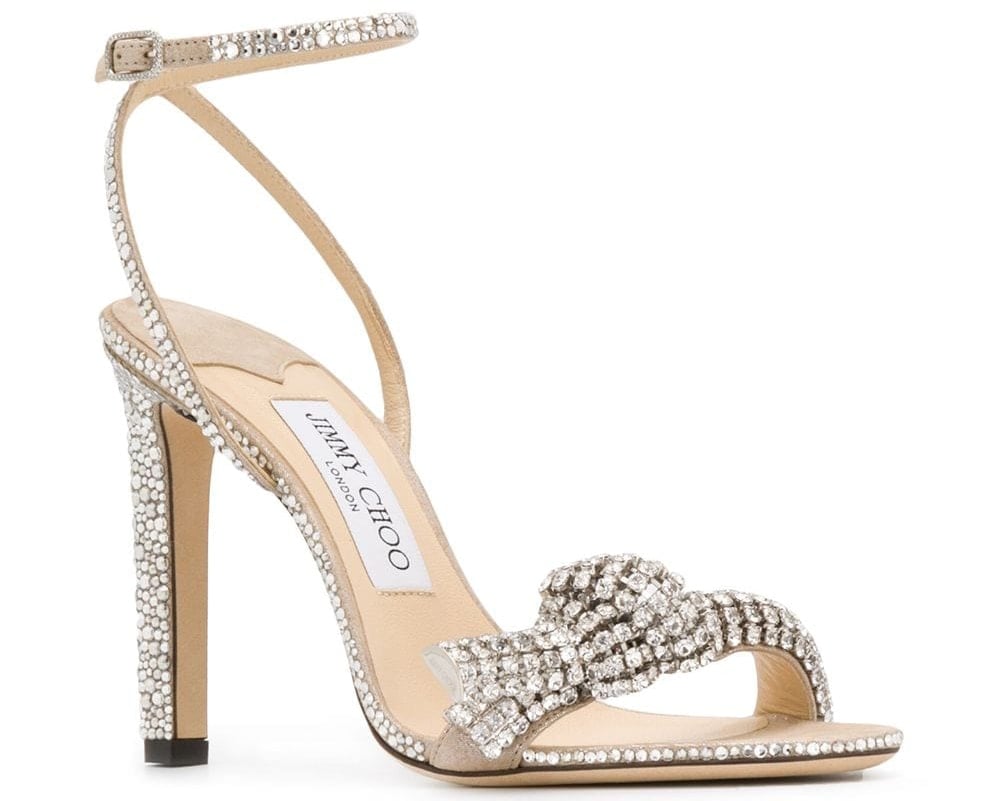The Jimmy Choo "Thyra" is embellished with sparkling crystals and features a knot detail and a 4-inch heel