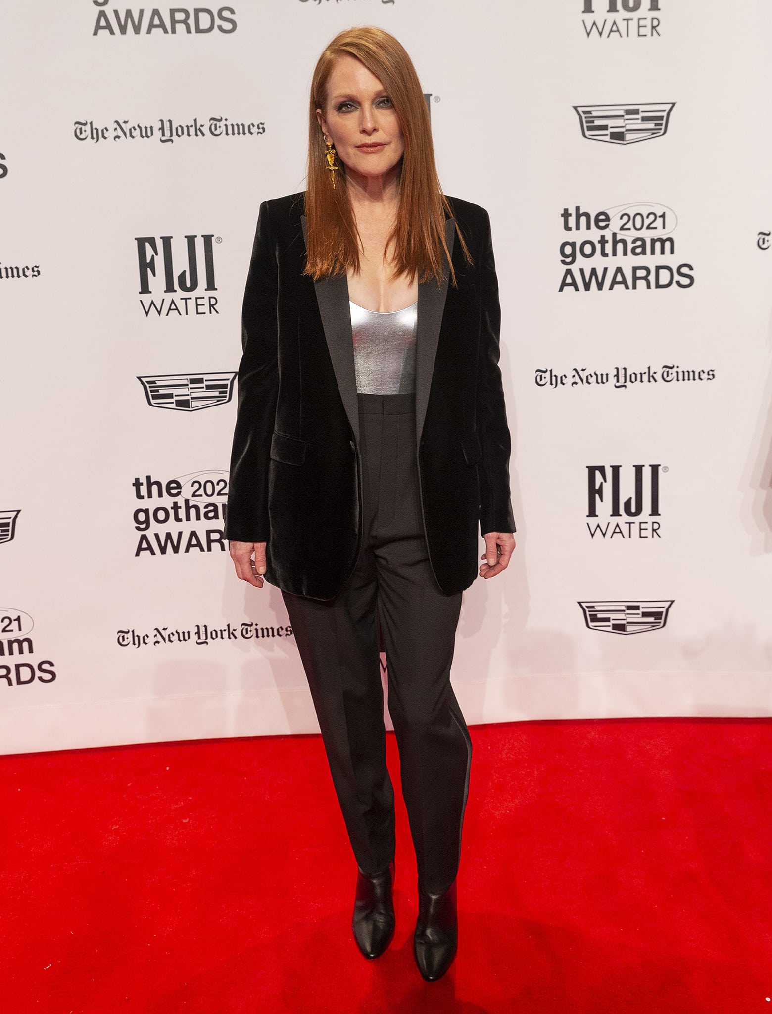 Julianne Moore flashes her cleavage in a Saint Laurent silver top and a black velvet blazer