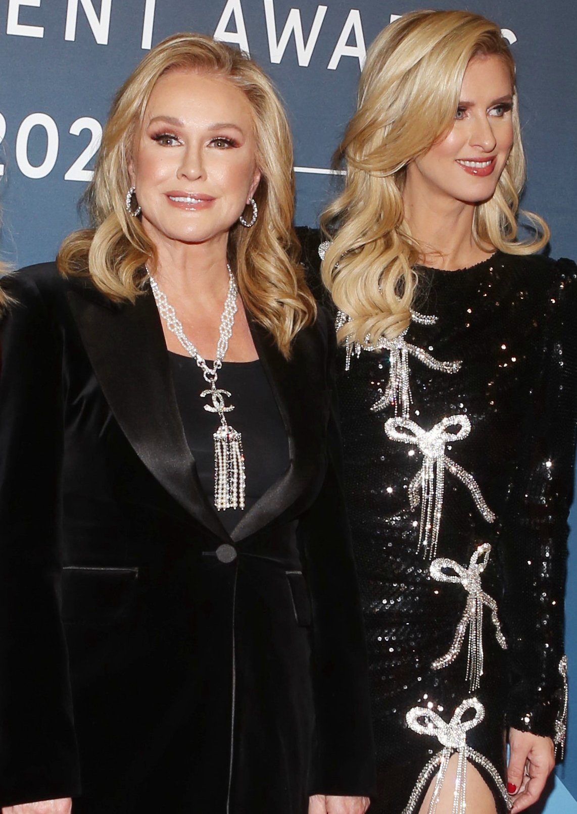 Kathy Hilton styles her blonde hair in soft curls and wears neutral makeup to highlight her features