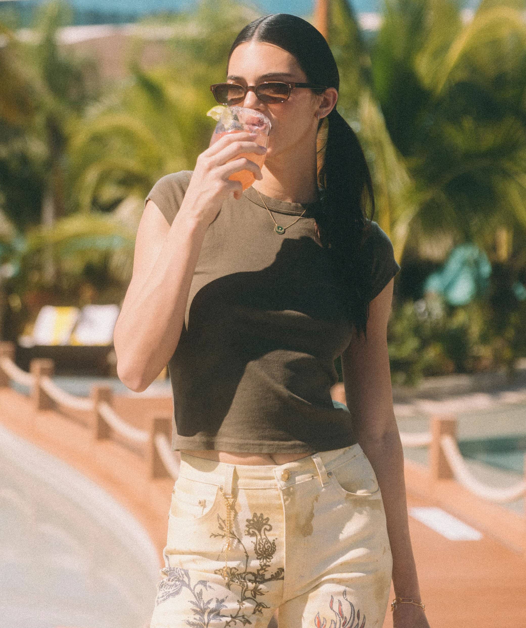 Kendall Jenner styles her hair in pigtails as she takes a sip of her 818 Tequila Watermelon Margarita cocktail