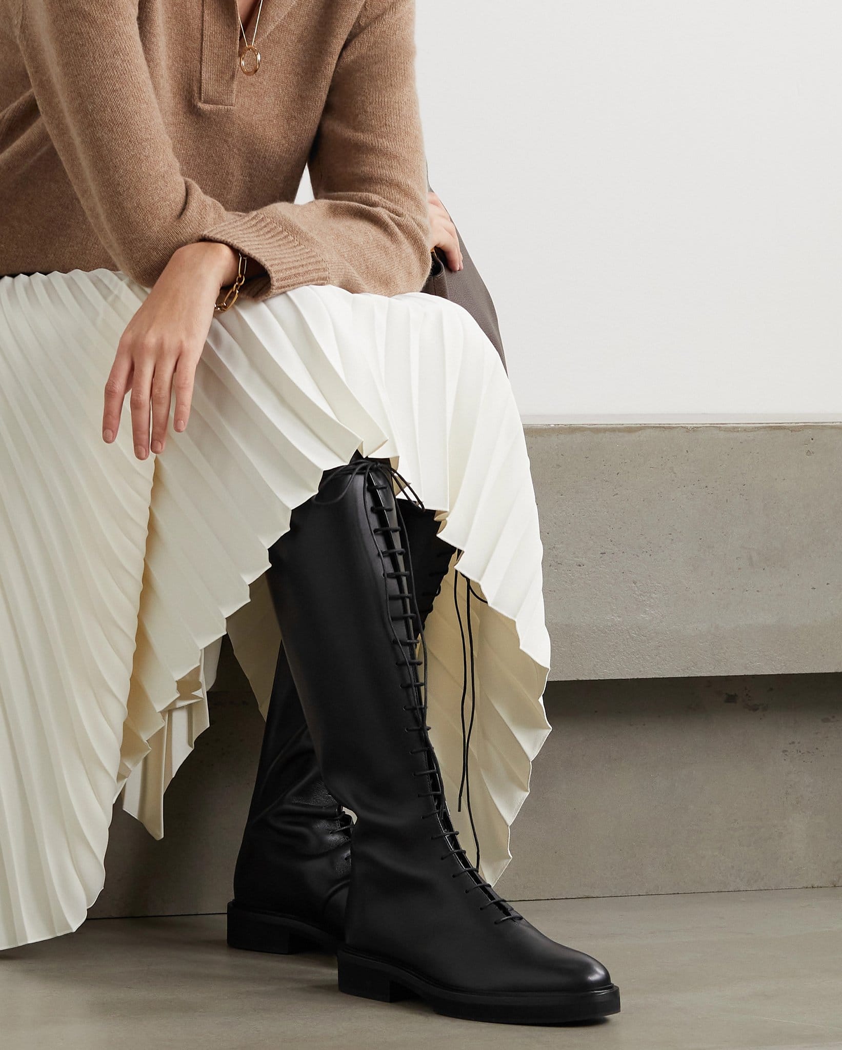 These timeless Khaite York boots are minimally designed from smooth black leather with lace-up front and short heels