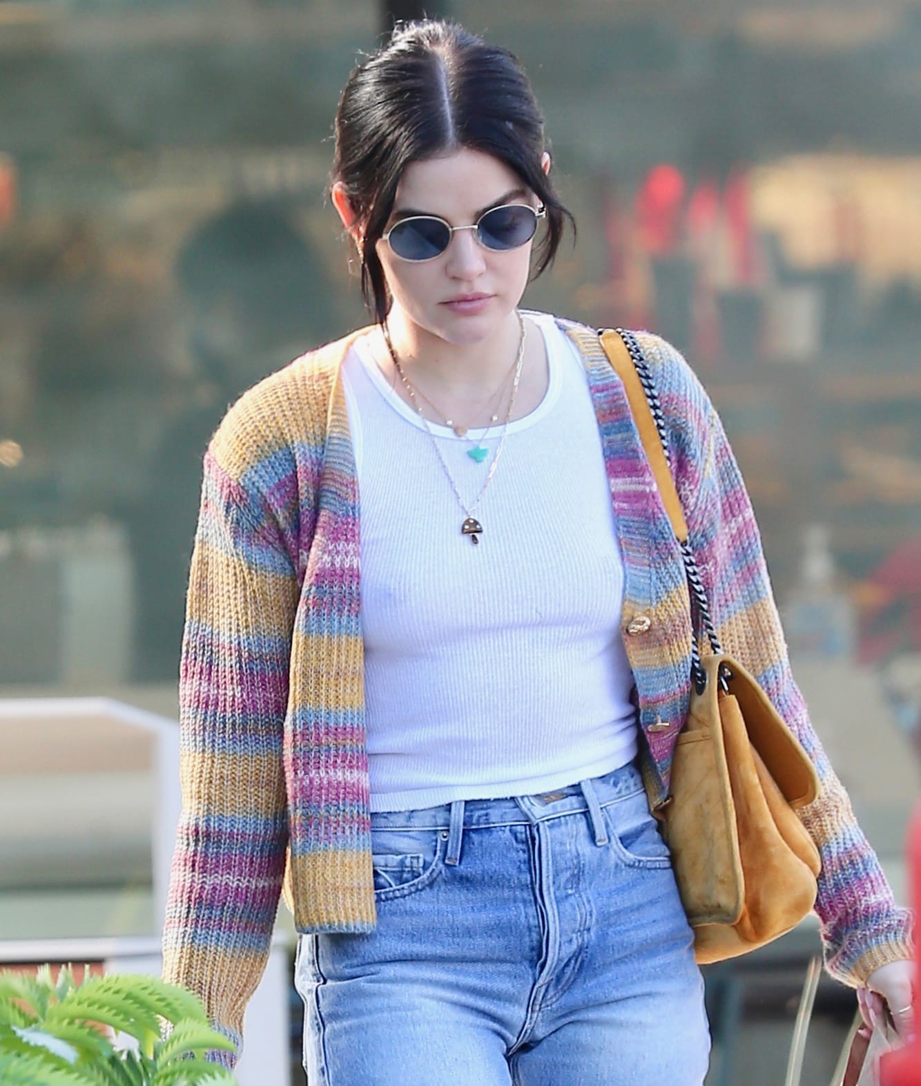 Lucy Hale ties her hair back and wears minimal soft pink makeup as she carries her stuff in Saint Laurent Niki quilted bag