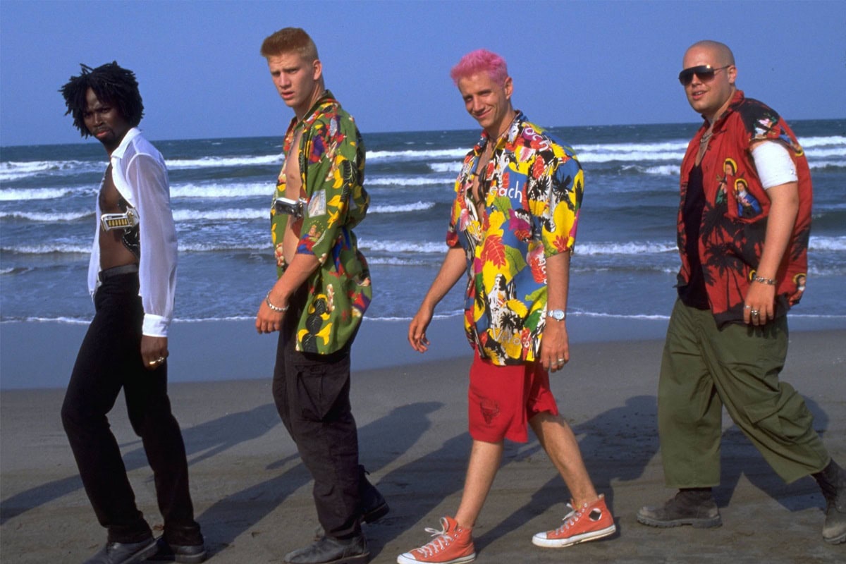 The Montague boys pair their bold Hawaiian shirts with combat boots and Chuck Taylors, a footwear choice that underscores their carefree, rebellious energy and “new money” edge