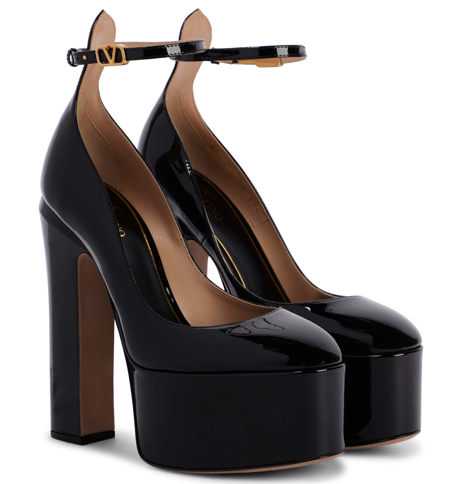 These Italian-crafted pumps feature towering platforms and heels, measuring about 2.2 inches and 6.1 inches, respectively