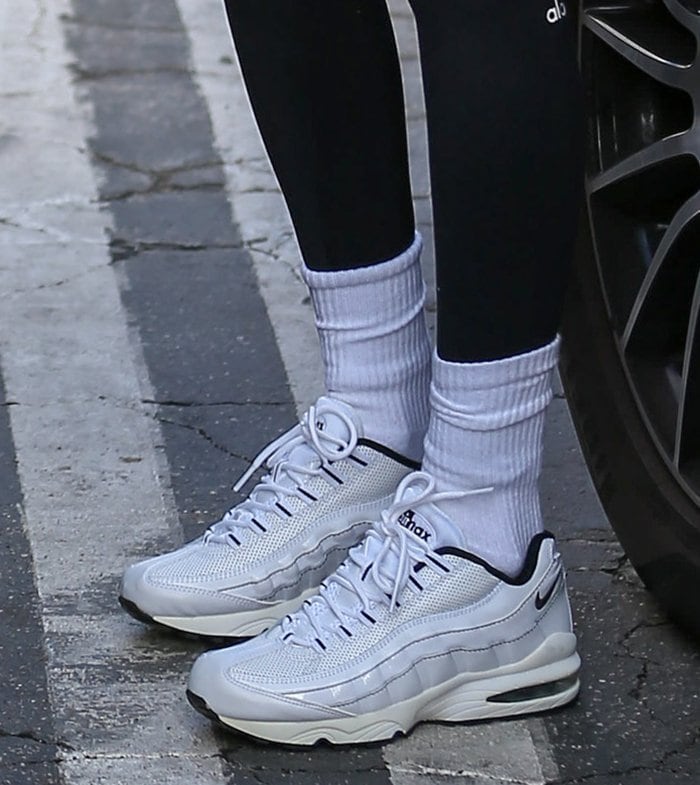 Bella Hadid pairs her chic sportswear with white crew socks and Nike Air Max shoes