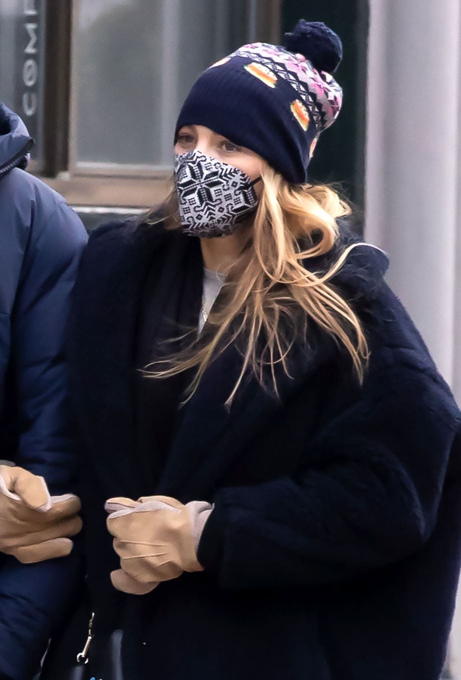 Blake Lively keeps a low-key look with a Maskc winter face mask and a patterned navy beanie