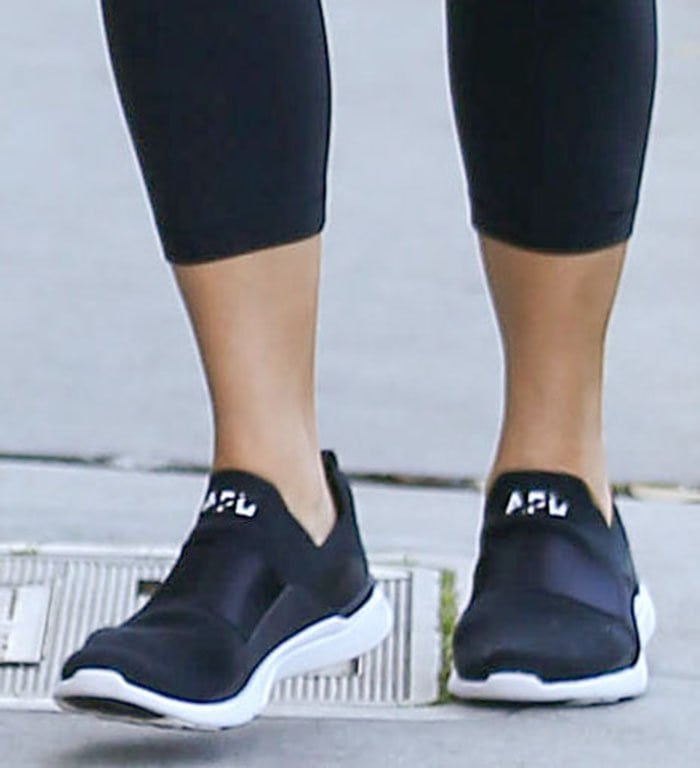 Chrissy Teigen rounded out her athleisure outfit with APL Techloom Bliss sneakers
