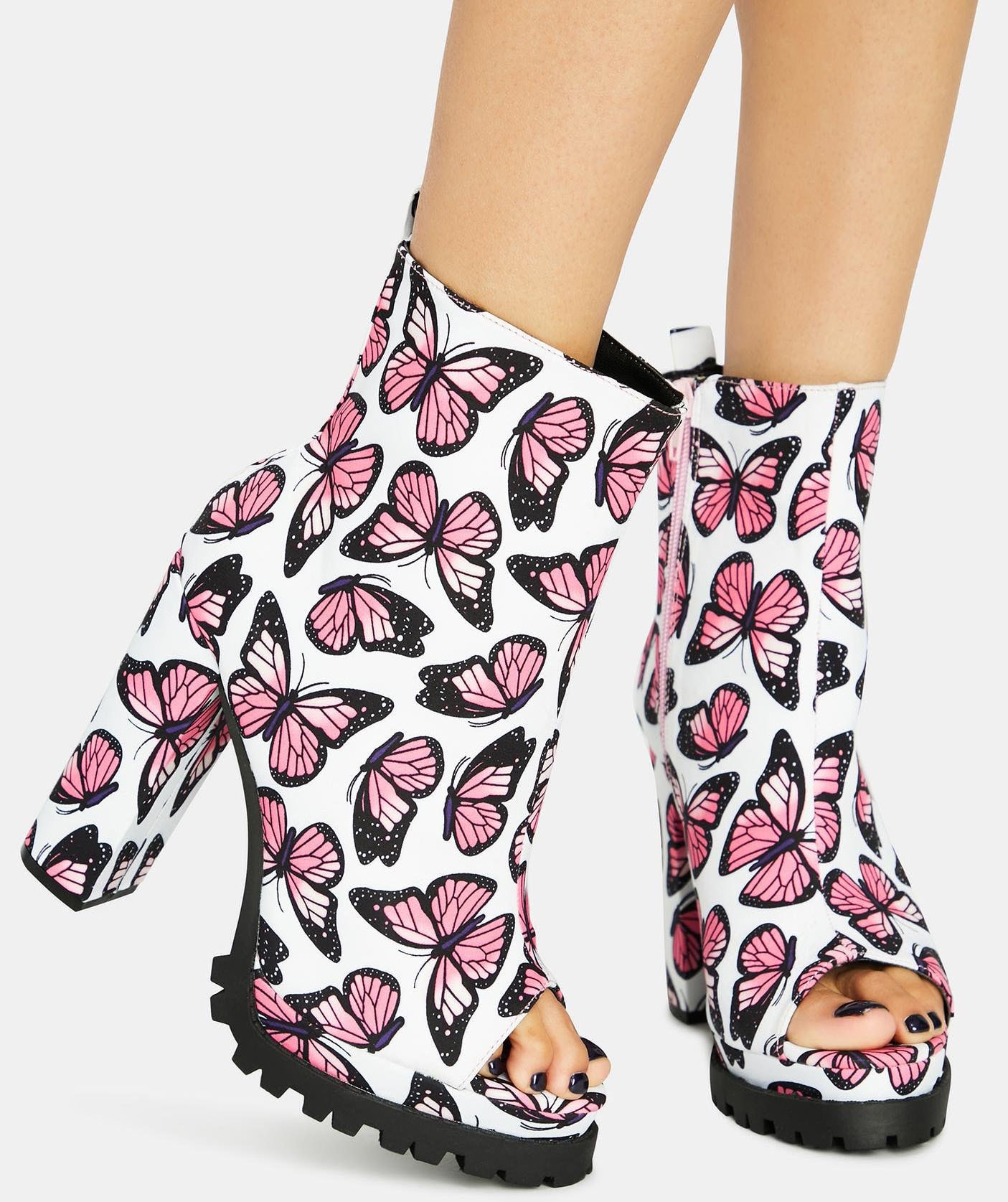 Whimsical butterfly prints add feminine flair to these chunky peep-toe booties