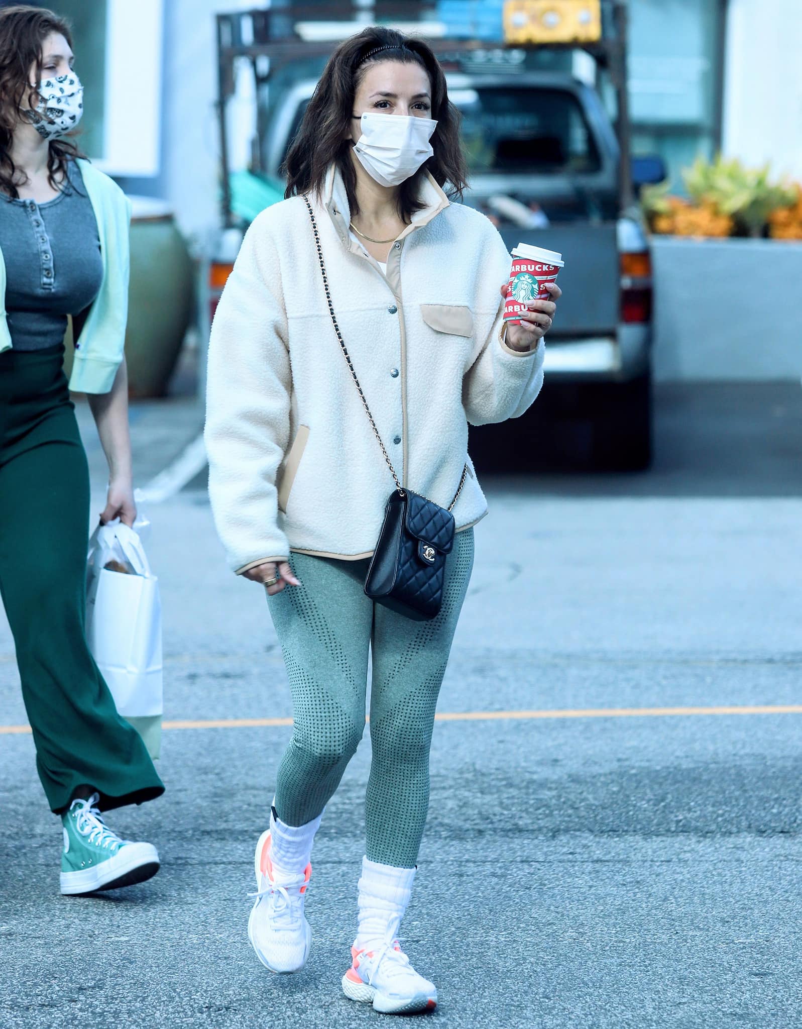 Eva Longoria stays cozy and warm in The North Face Cragmont fleece jacket and green leggings