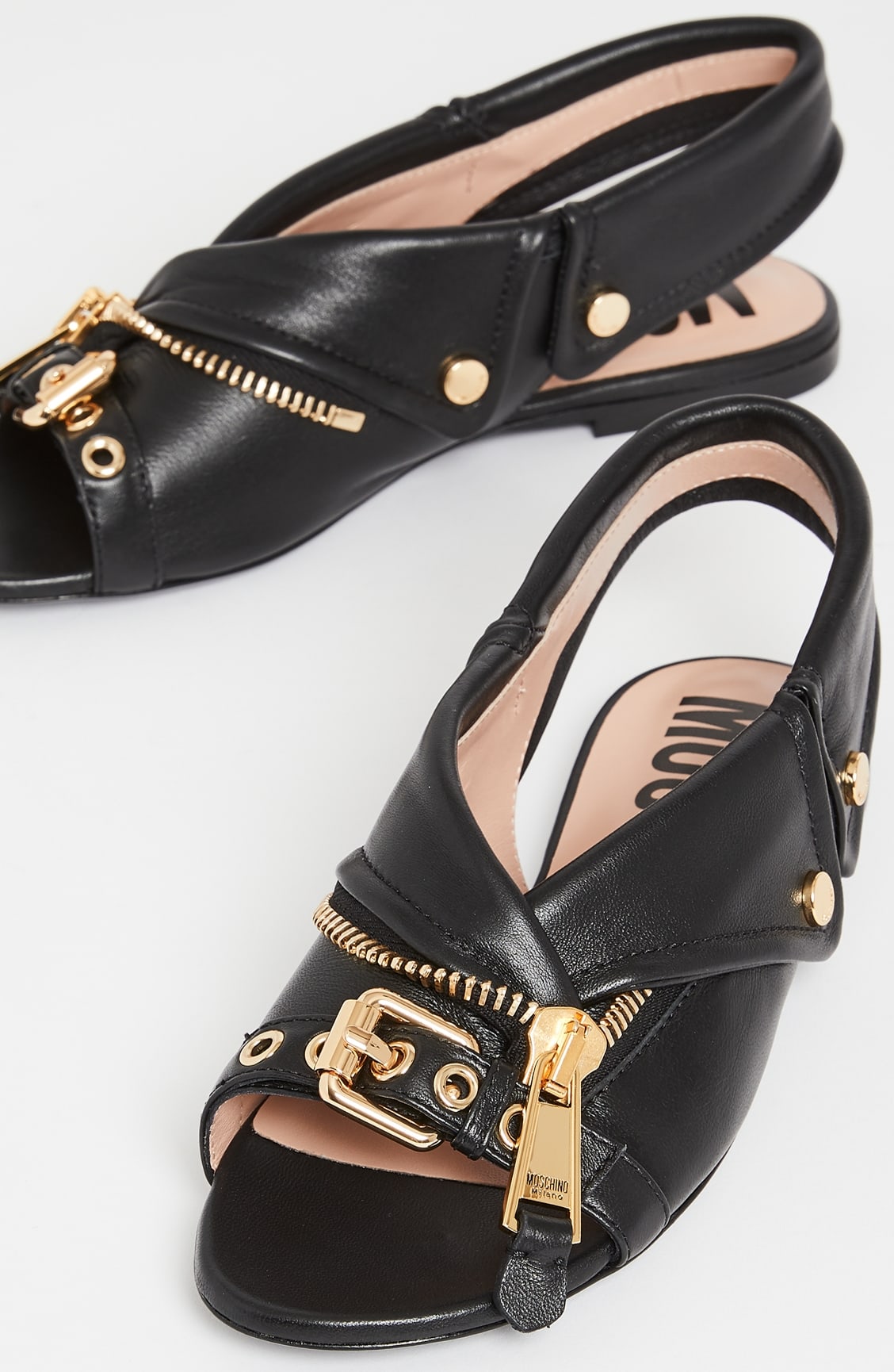 Flat slingback sandals with gold-tone hardware inspired by biker jackets