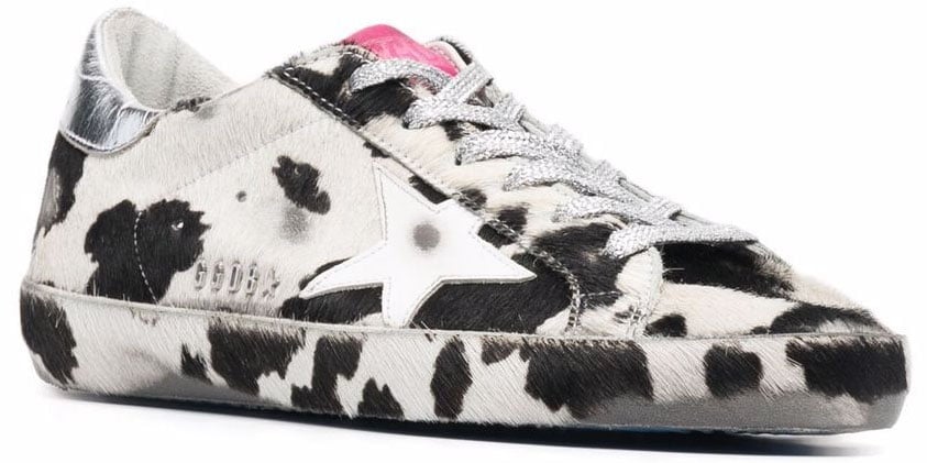 Pair these cow-printed sneakers with solid color athleisure for cool and chic street style