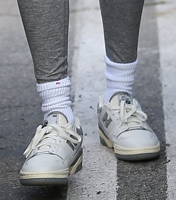 Hailey Bieber completes her gray athleisure with white and gray Aime Leon Dore x New Balance P550 sneakers