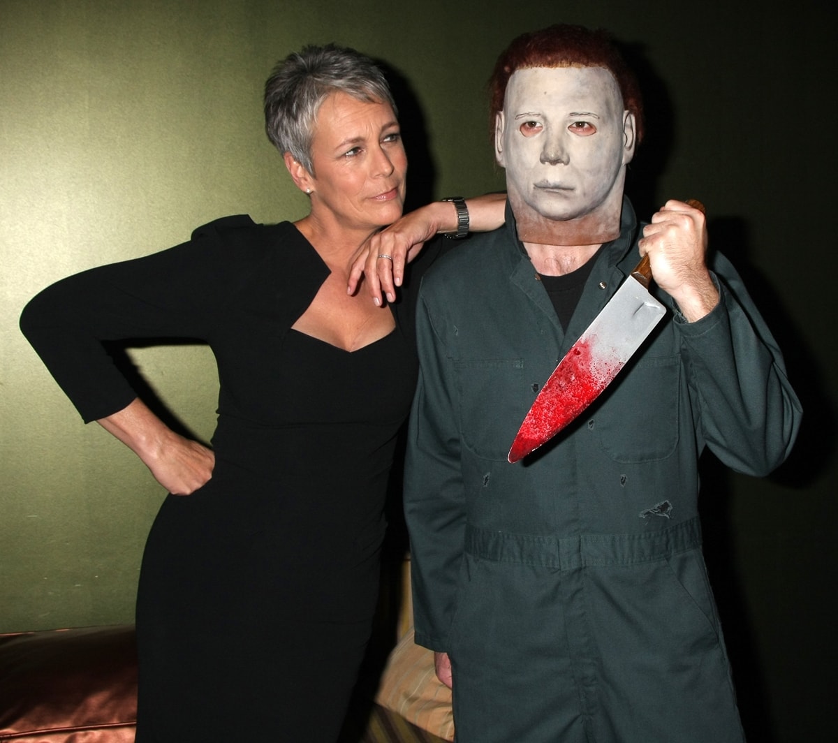 Actress Jamie Lee Curtis poses backstage with Michael Myers