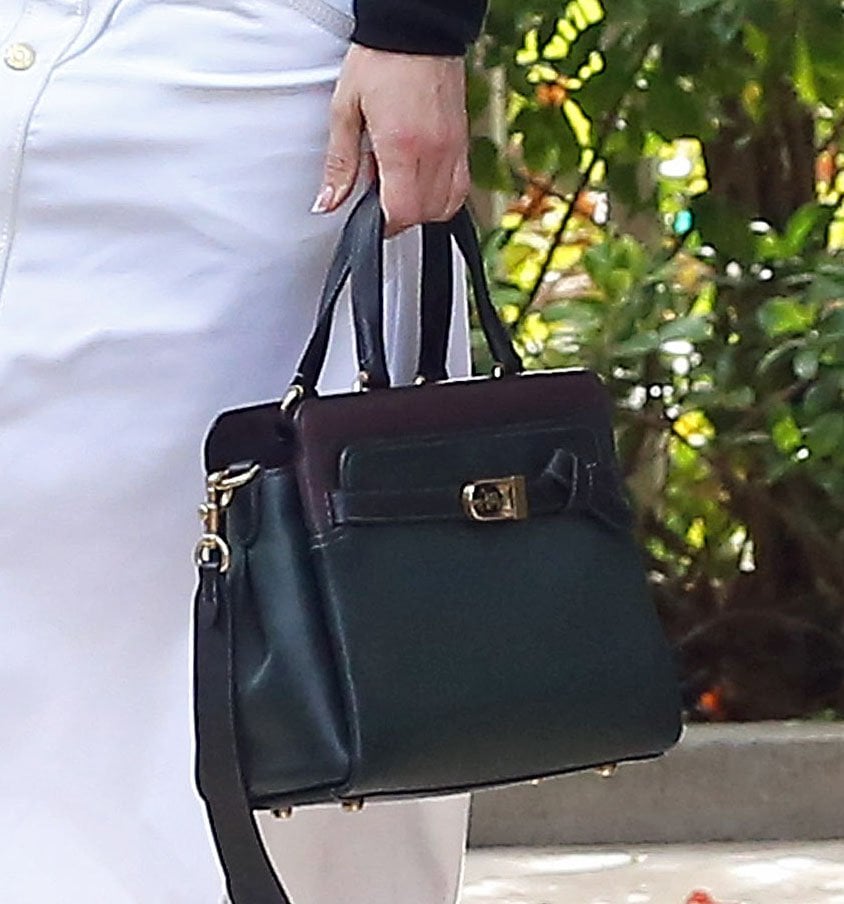 Coach ambassador Jennifer Lopez carries her stuff in a Coach Tate carryall