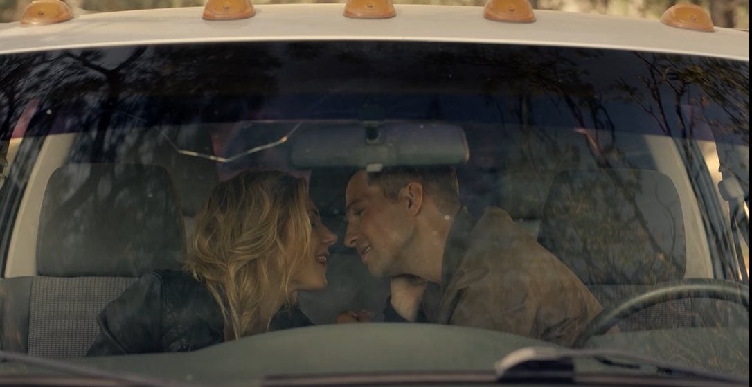 Katheryn Winnick as Jenny Hoyt and Logan Marshall-Green as Travis Stone get ready to kiss in Big Sky