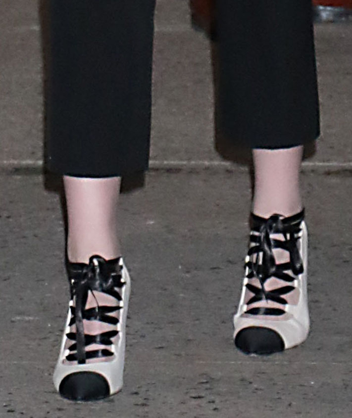 Kristen Stewart pairs her edgy outfit with two-tone lace-up pumps