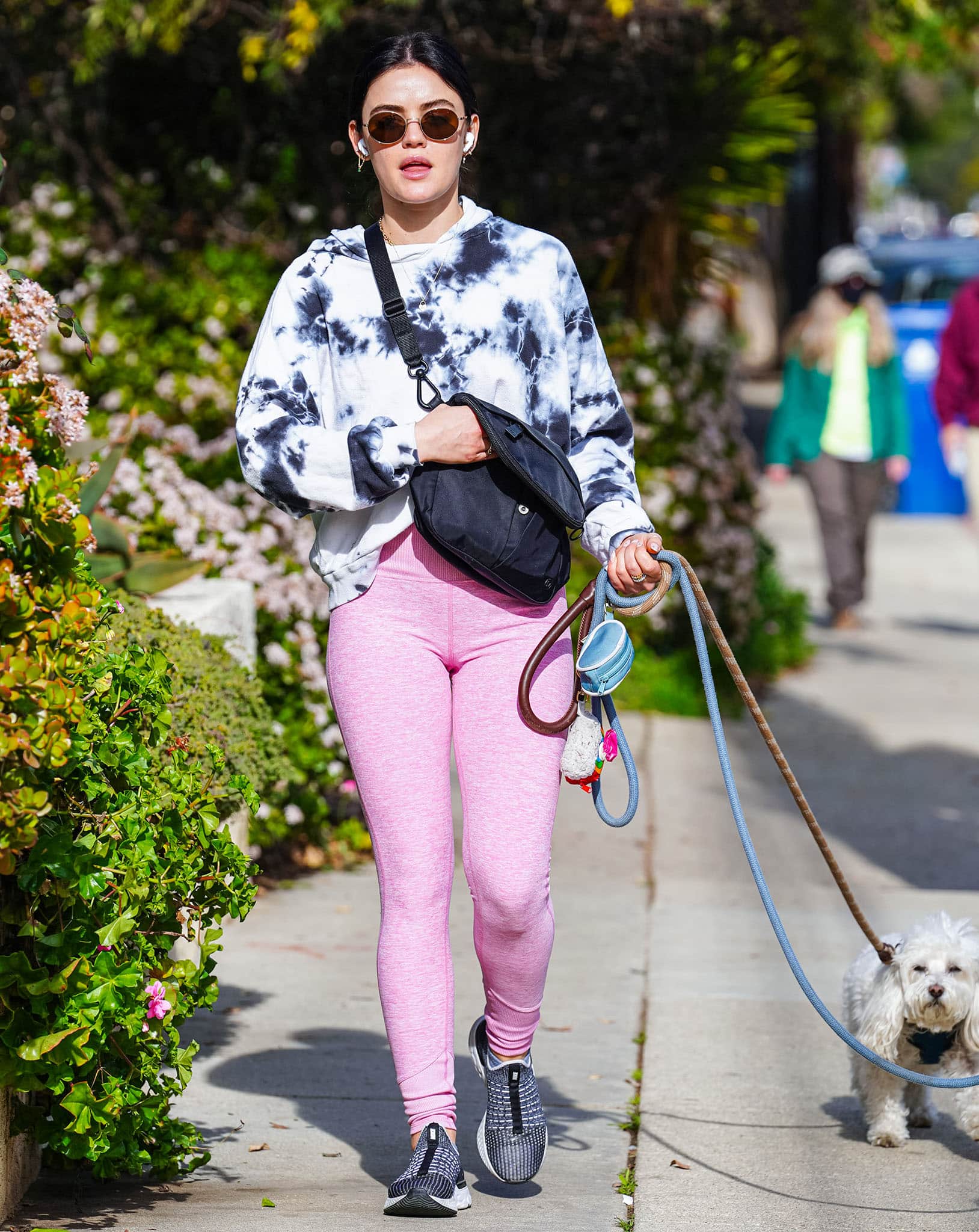 Lucy Hale pairs a blue-and-white tie-dye hoodie with pink leggings