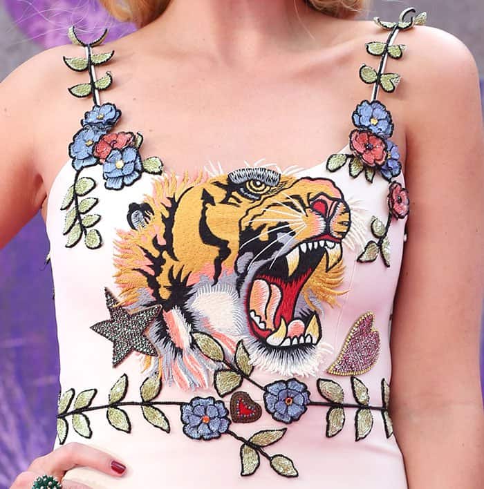 Margot Robbie's Gucci dress features flower detailing and a tiger motif across the chest