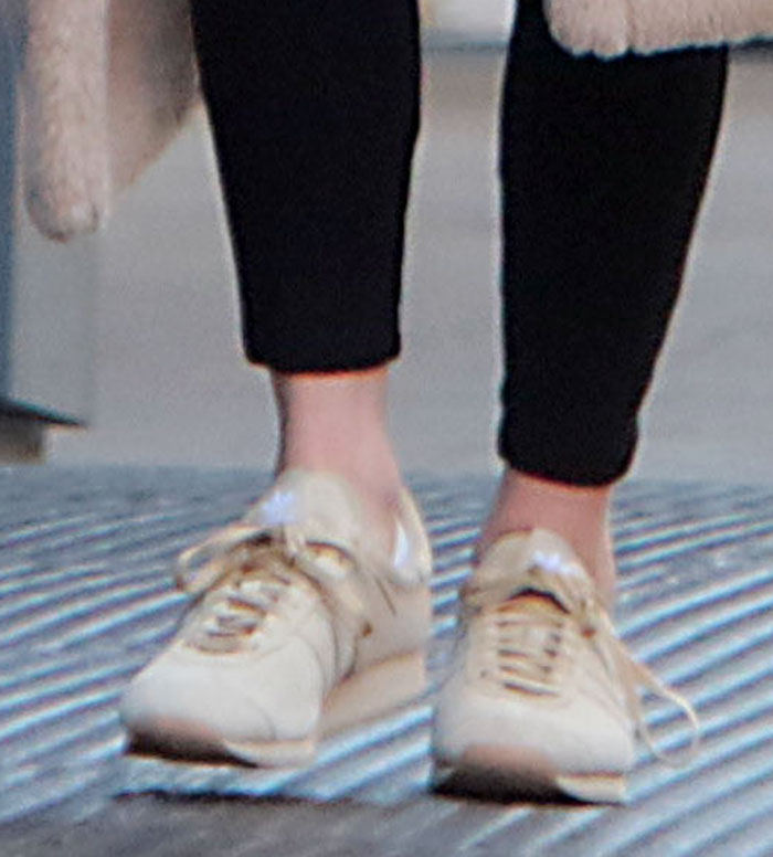Nicky Hilton completes her laidback winter outfit with Khaite x Adidas Originals suede sneakers