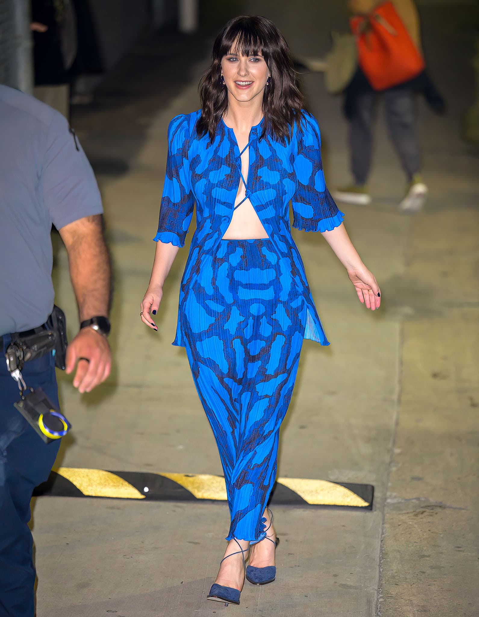 Rachel Brosnahan flashes her abs and boobs in Altuzarra blue moth-print plisse top and maxi skirt