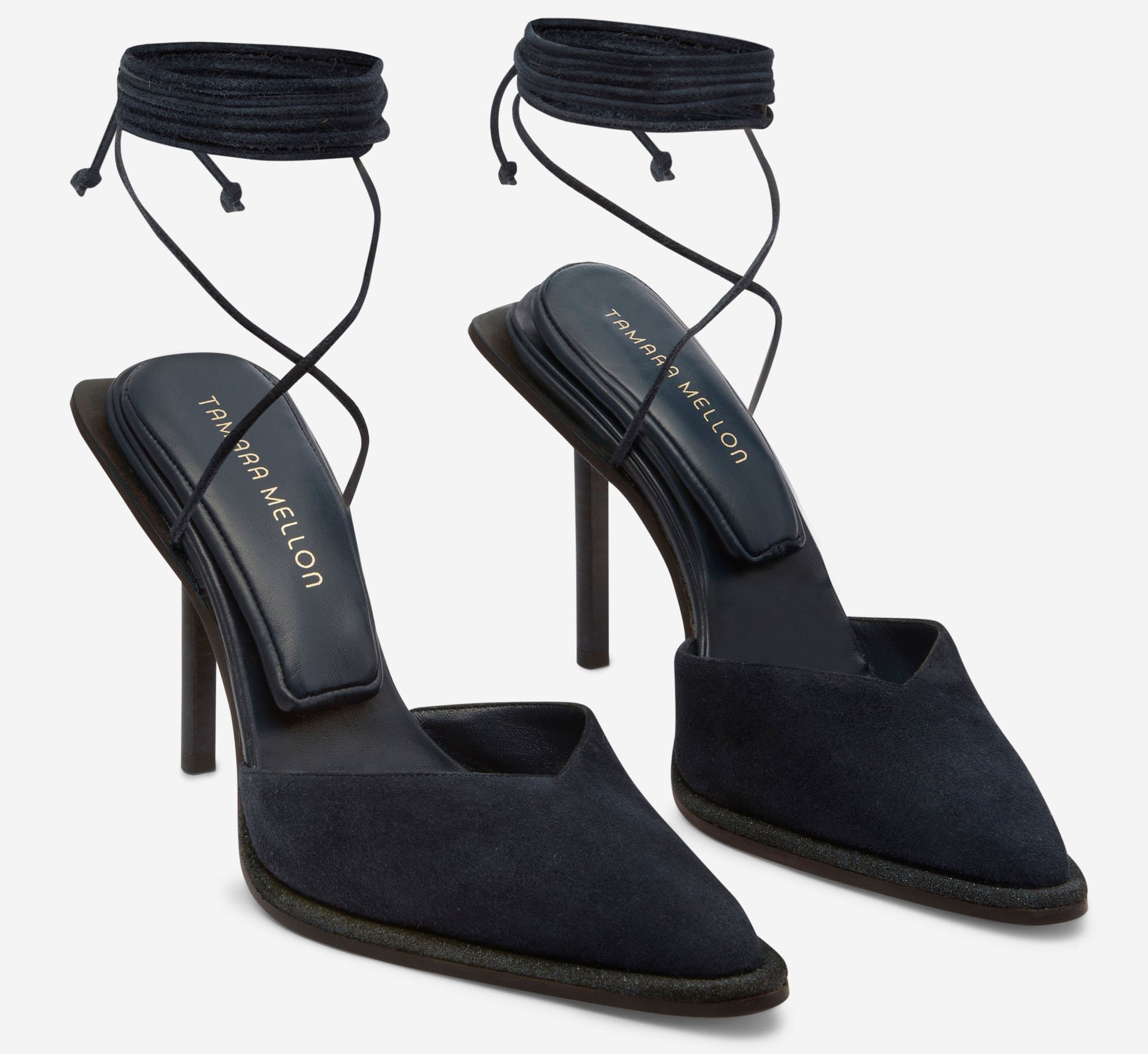 The Tamara Mellon Comet pumps feature a suede upper with glittery welt, a pillow top insole, wraparound straps, and high heels