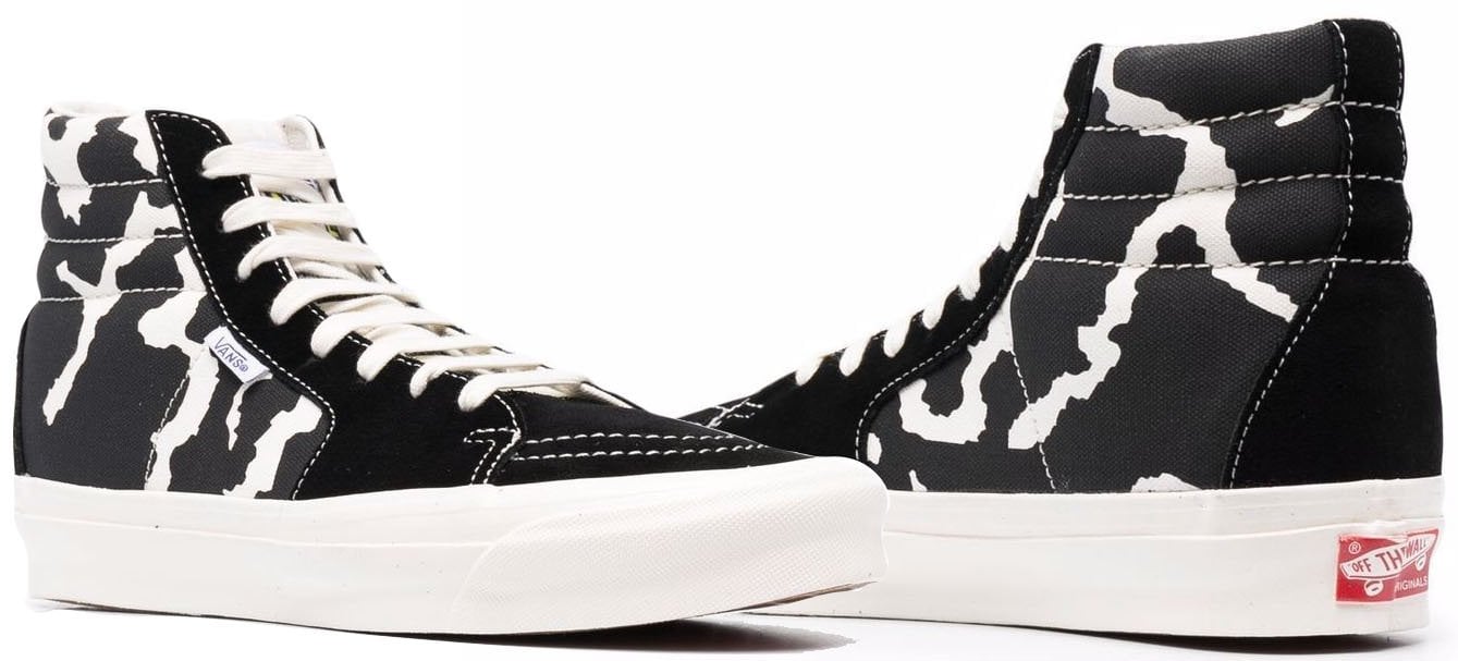 For a touch of quirk, add these bold Vans cow-printed sneakers to your laid-back outfit