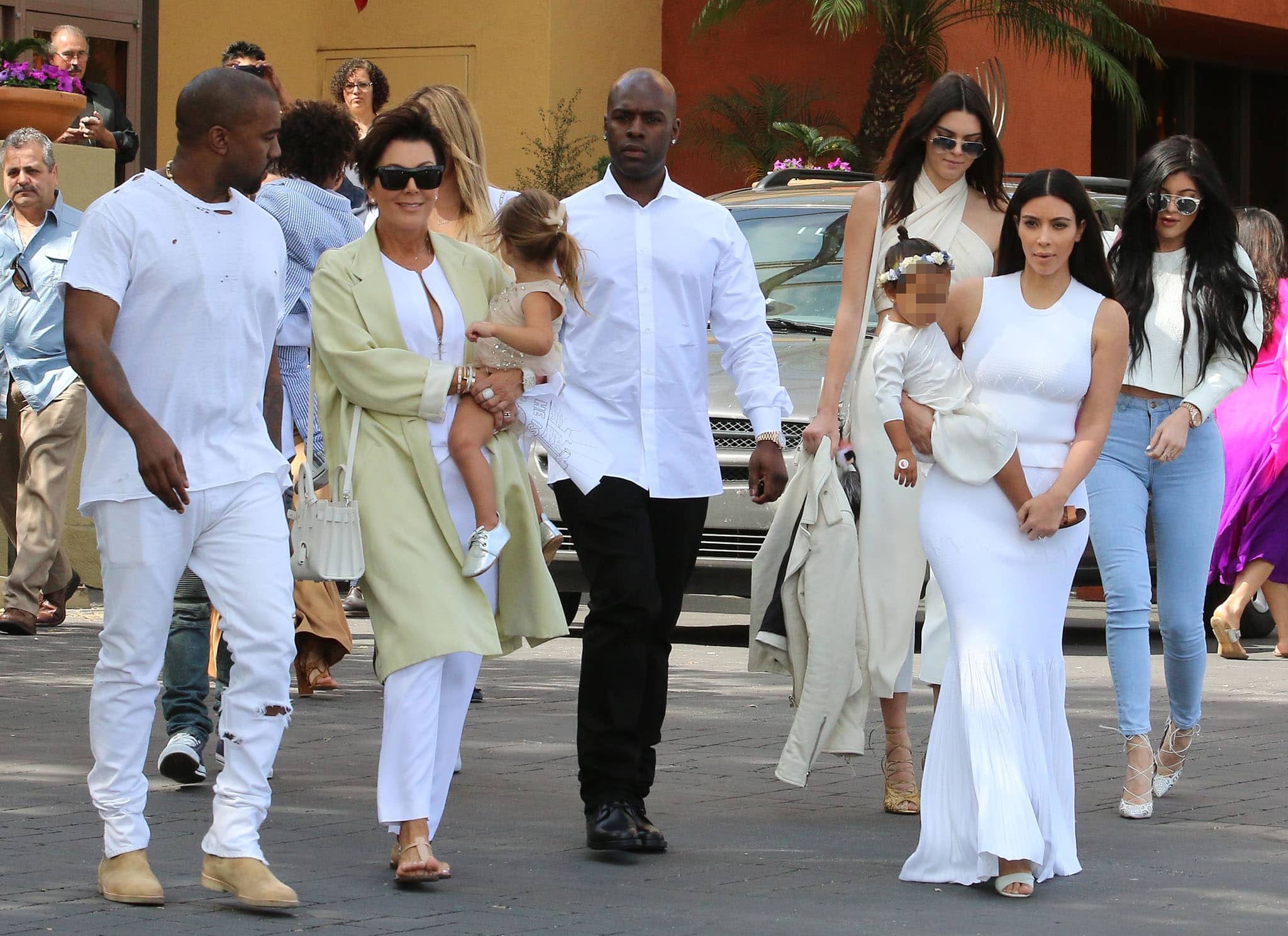 The Kardashian-Jenner family turn heads in striking white outfits as they attend church in Woodland Hills on April 5, 2015