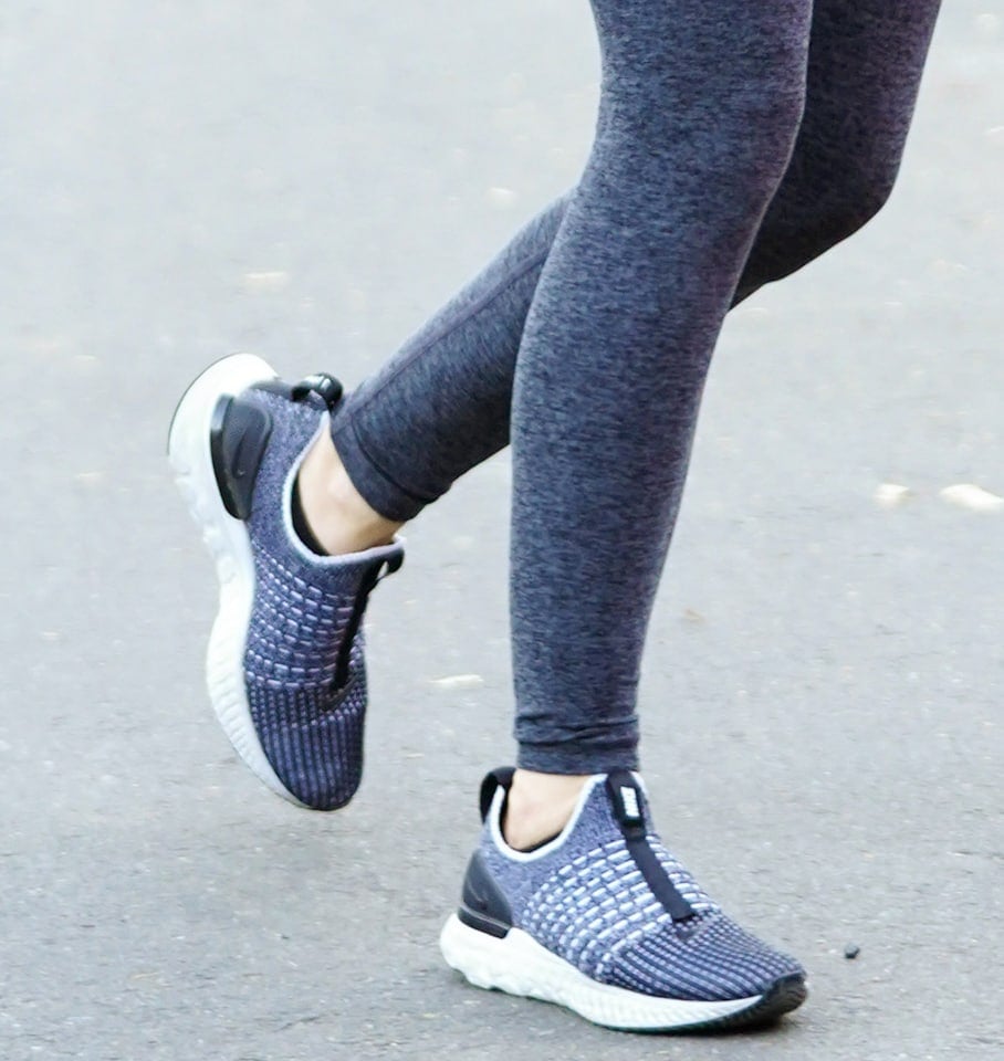 Lucy Hale coordinates her gray leggings with Nike React Phantom Run Flyknit sneakers