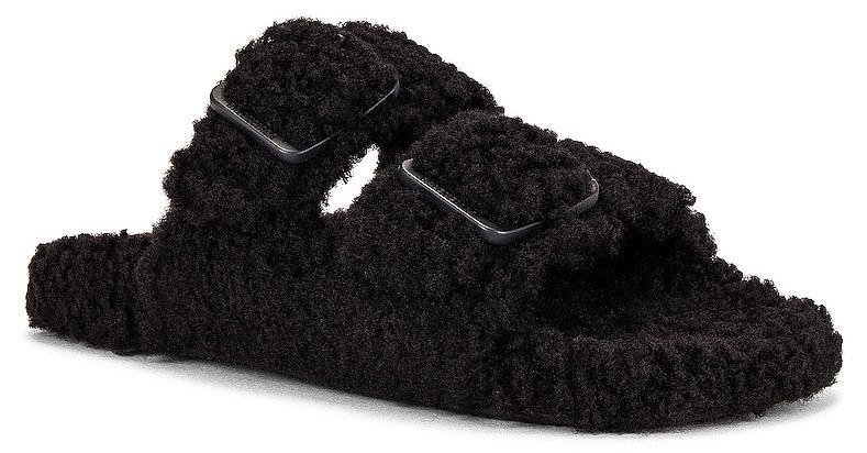 The Balenciaga Mallorca slides boast a recycled faux fur upper with buckles and rubber soles