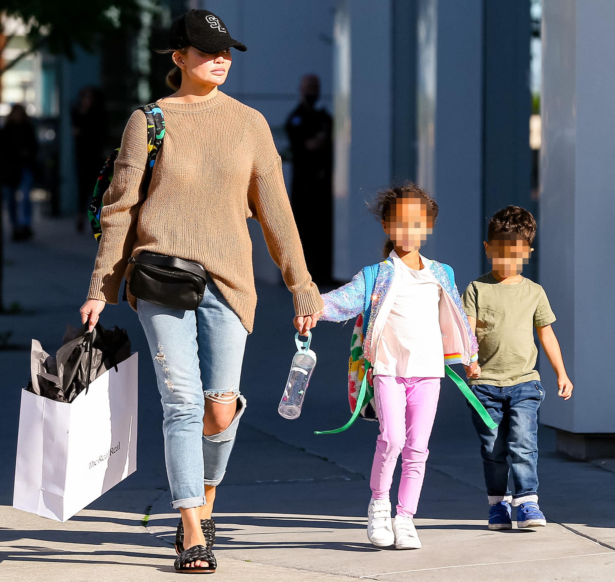 Chrissy Teigen goes shopping with her kids, Luna and Miles, in West Hollywood on February 16, 2022