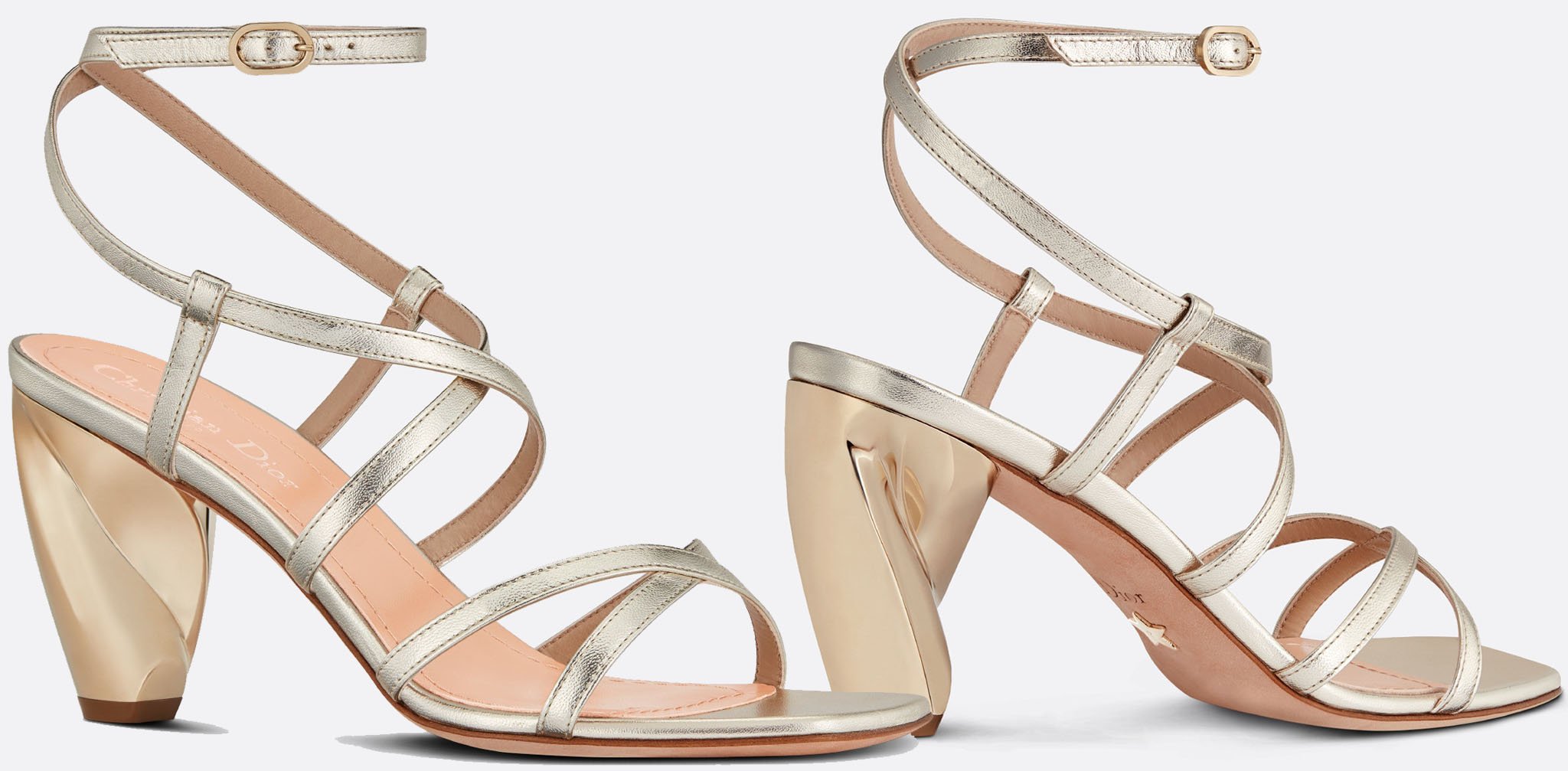 The strappy Dior Rhodes is characterized by the gold-finish architectural heel inspired by the sculptures of Constantin Brancusi