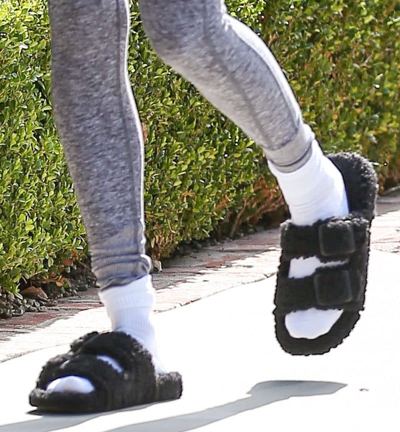 Hailey Bieber completes her Pilates look with white socks and Balenciaga Mallorca furry slides