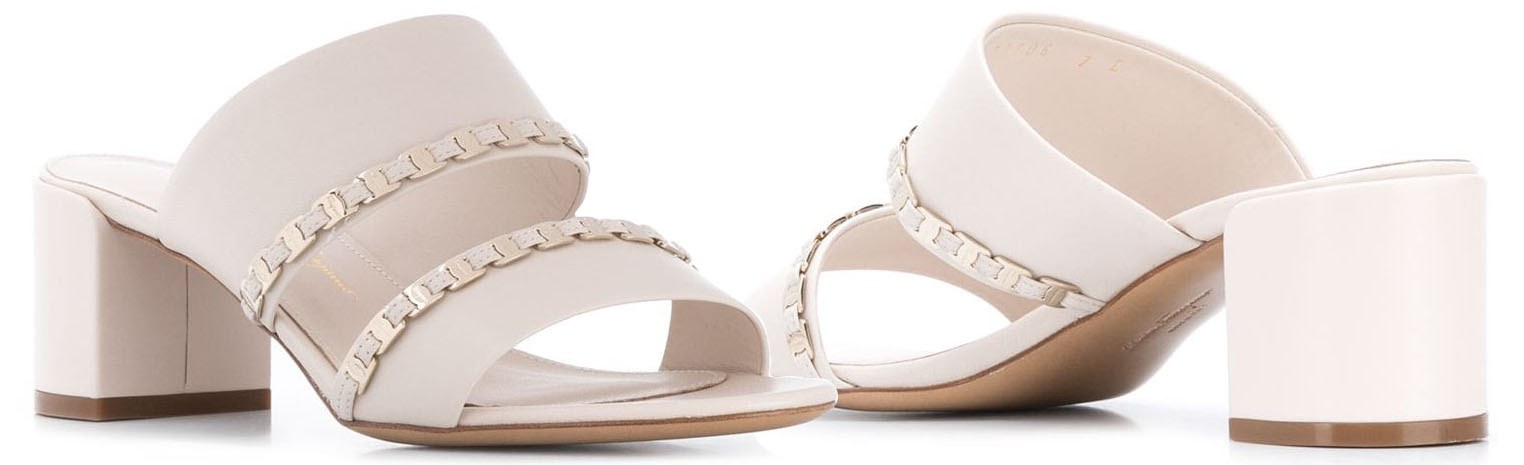 Versatile and comfy, Salvatore Ferragamo's Vara sandals have short block heels and braided leather-and-chain accents on the straps
