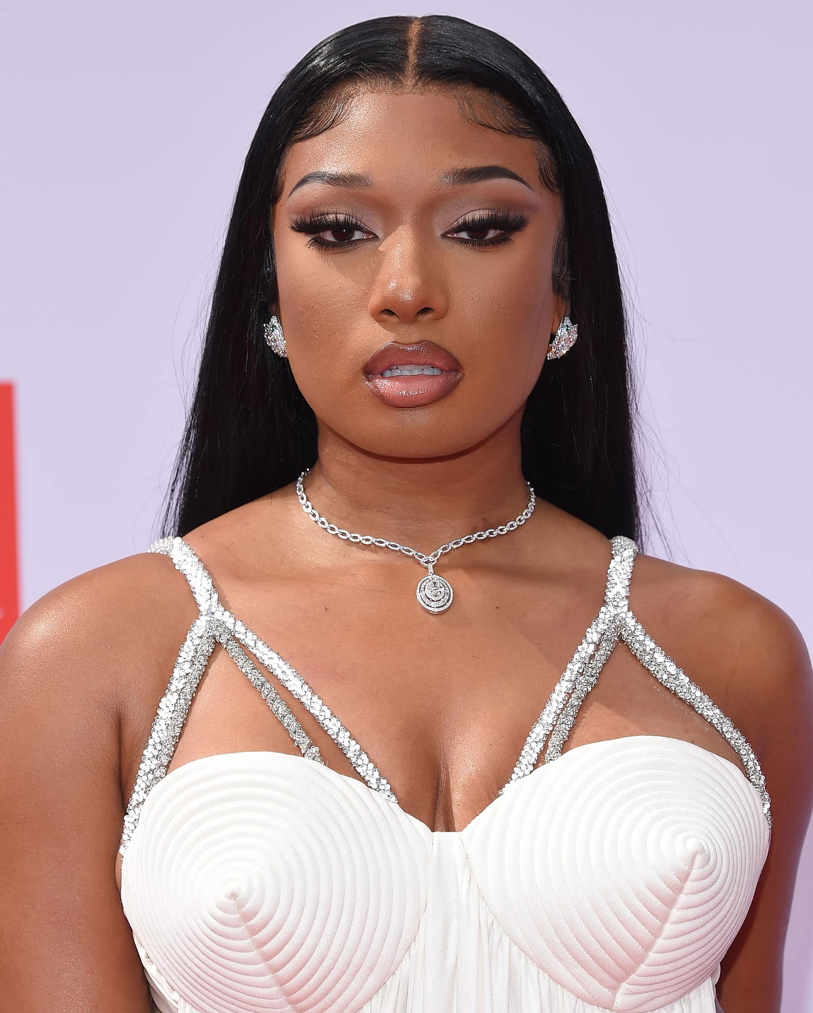 Megan Thee Stallion was exposed to music from a very early age as her mother, Holly Thomas, was a rapper who went by the rap name Holly-Wood