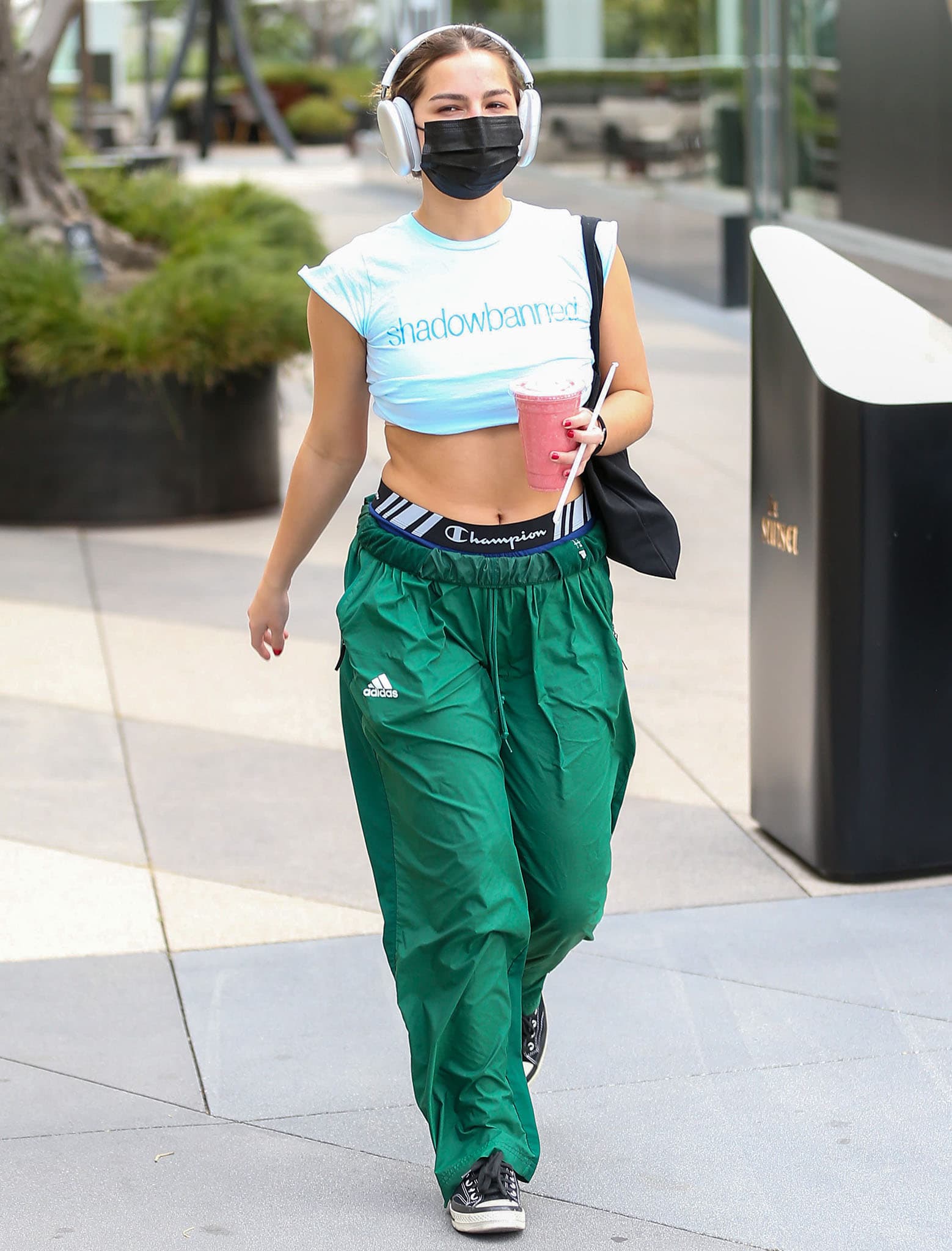 Addison Rae steps out for Pilates class in "shadowbanned" crop top and Adidas green pants after sharing new movie news on February 23, 2022