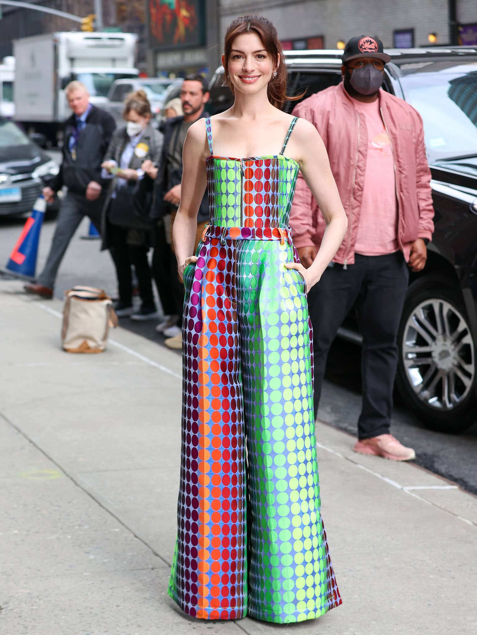 Anne Hathaway in a Christopher John Rogers multicolored set and Giuseppe Zanotti heels