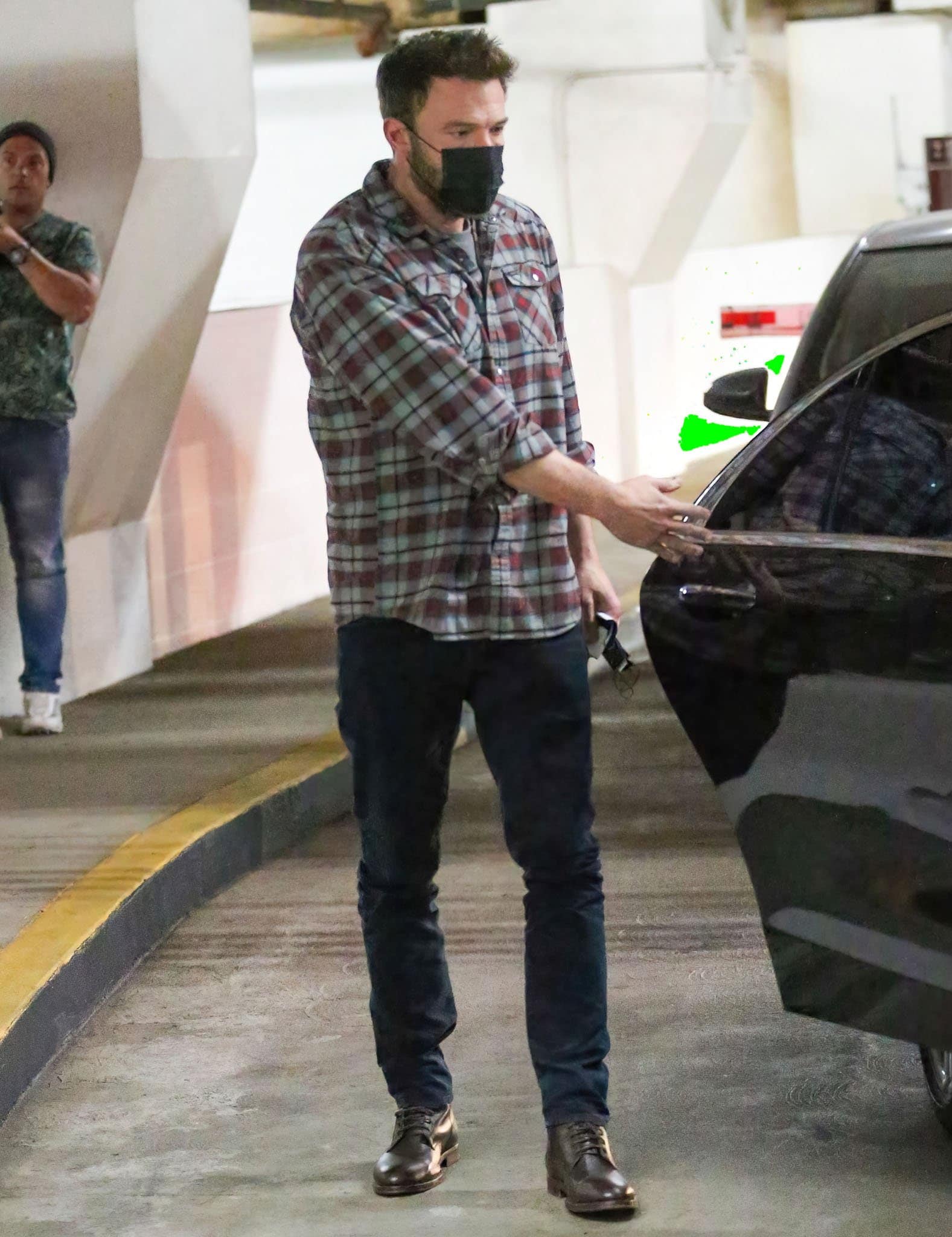 Ben Affleck opts for his signature look, with Howler Brothers flannel shirt, navy jeans, and dress shoes