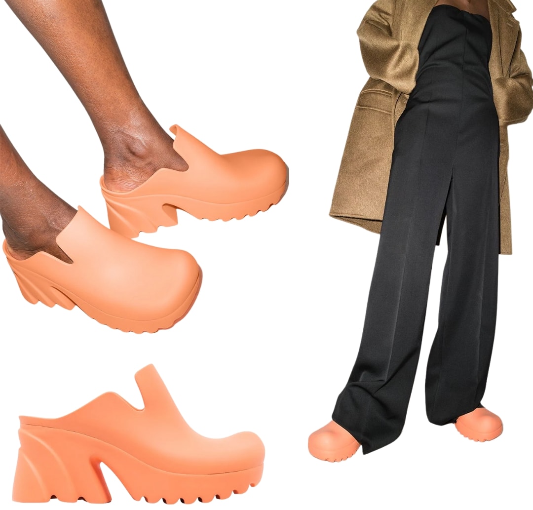 In a vibrant papaya orange hue, these these rubber clogs feature a square toe and is set atop a high block heel
