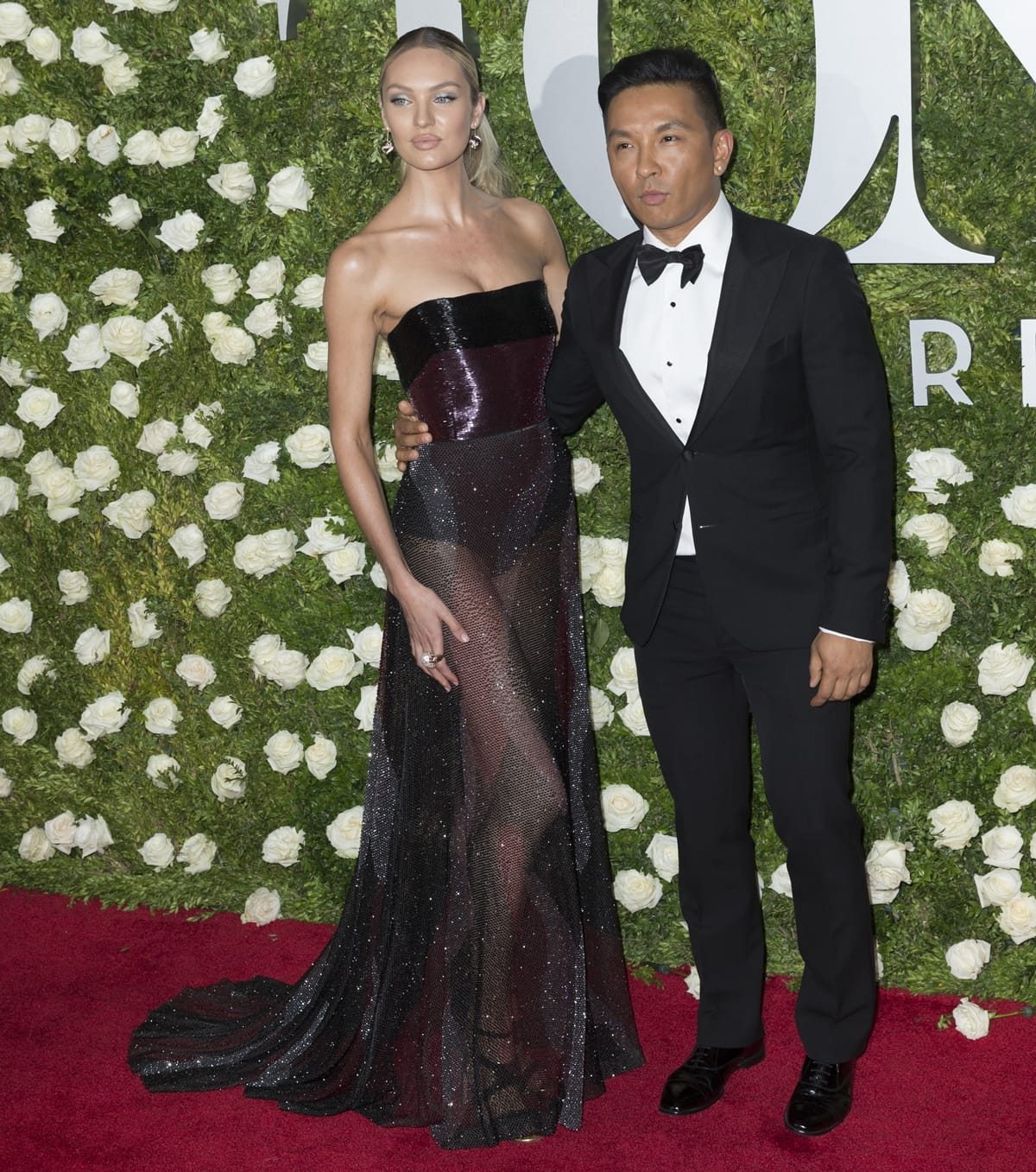 Candice Swanepoel in Prabal Gurung posing with the fashion designer at the Tony Awards