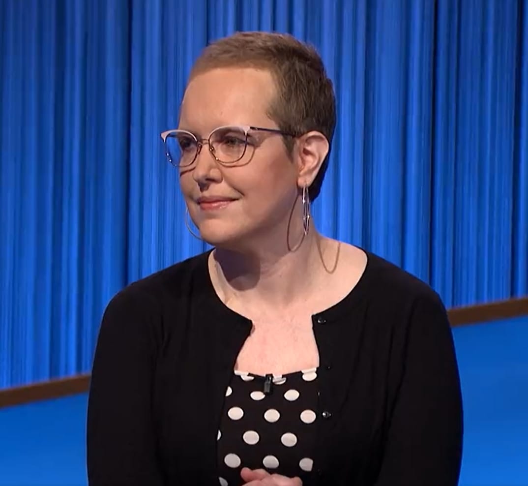 Four-day Jeopardy! score leader Christine Whelchel embracing her do