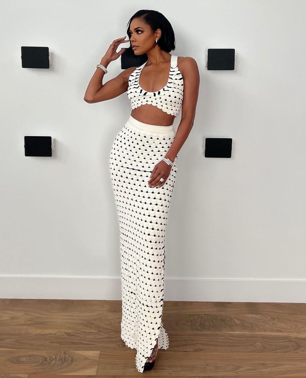 Gabrielle Union shows off her figure in Altuzarra’s Fall 2022 scalloped crop top and maxi skirt at Cheaper by the Dozen Los Angeles premiere on March 16, 2022