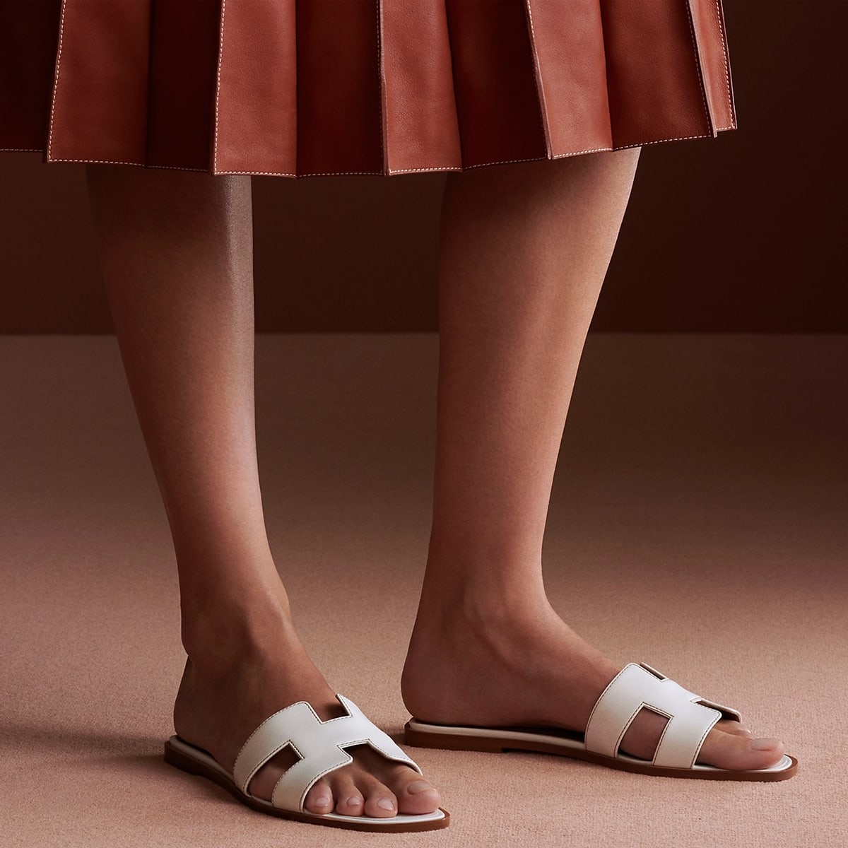 The classic Hermès Oran sandals were created by luxury shoe designer Pierre Hardy in 1997