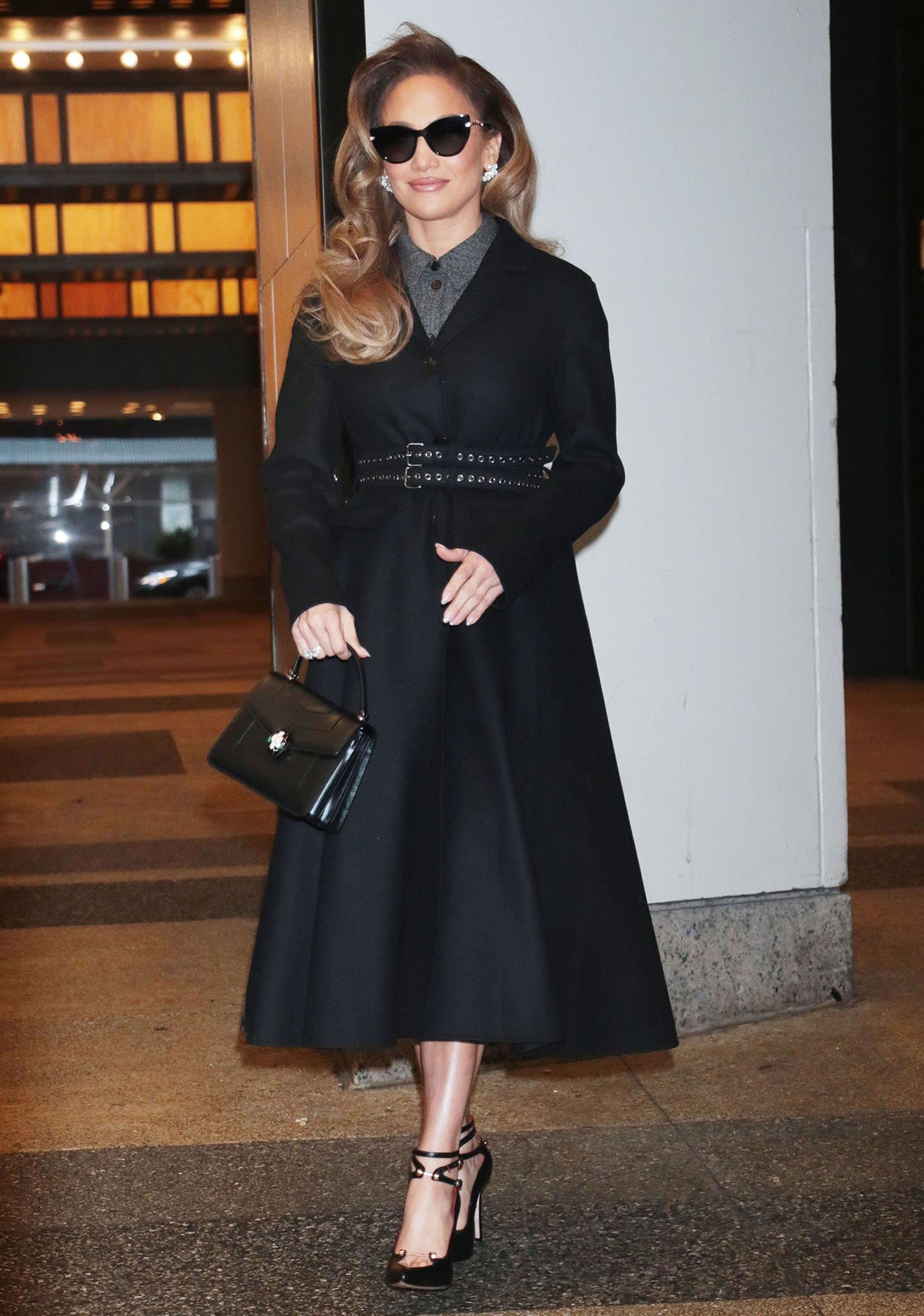Jennifer Lopez looks sophisticated in Dior charcoal gray dress and A-line wool coat on February 4, 2022