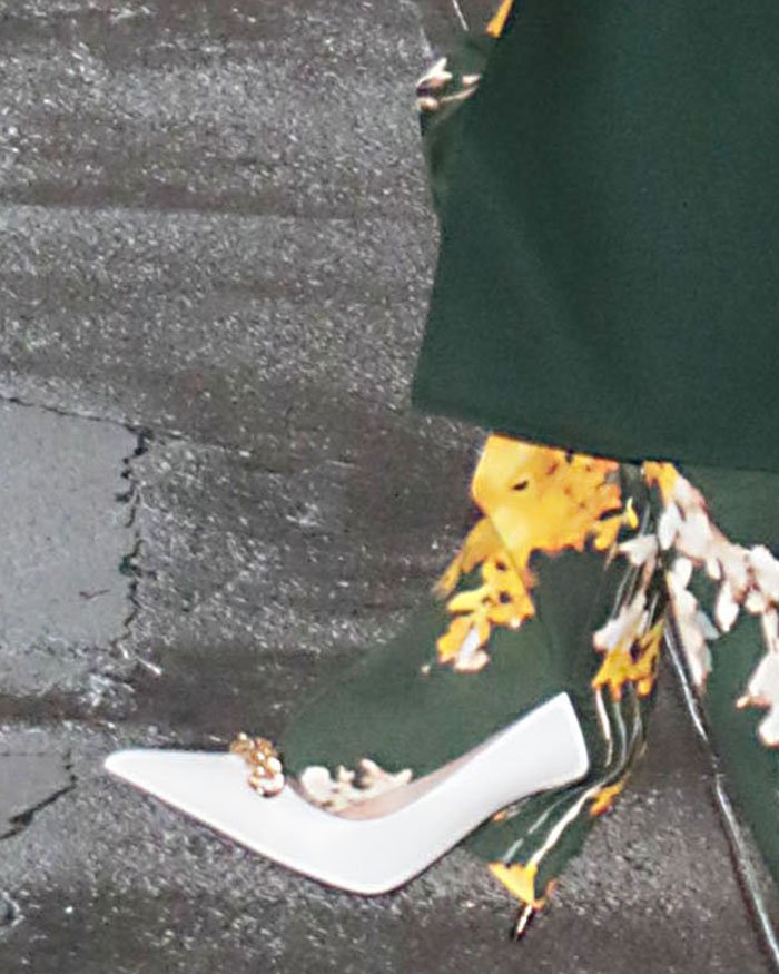 Jennifer Lopez pairs her dominant green ensemble with white Tom Ford Iconic Chain pumps